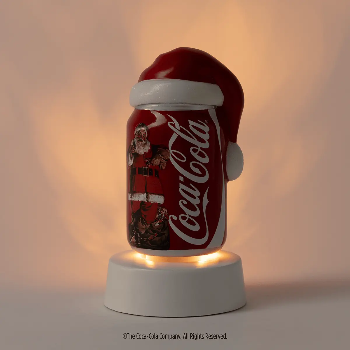 Coca-Cola Scentsy Launch Confirmed: Mini Warmer and Wax Melts From 21 October 2026 Coca-Cola Sparkling Holidays Scentsy mini warmer tabletop base lit in a dark room UK Europe 2026