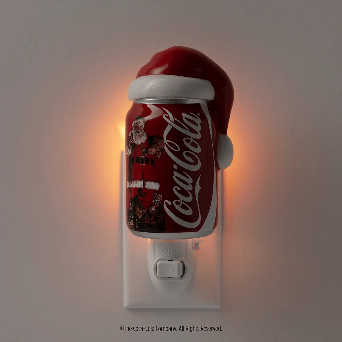 Coca-Cola Scentsy Launch Confirmed: Mini Warmer and Wax Melts From 21 October 2026 Coca-Cola Sparkling Holidays Scentsy mini warmer lit in a dark room UK Europe 2026 new launch